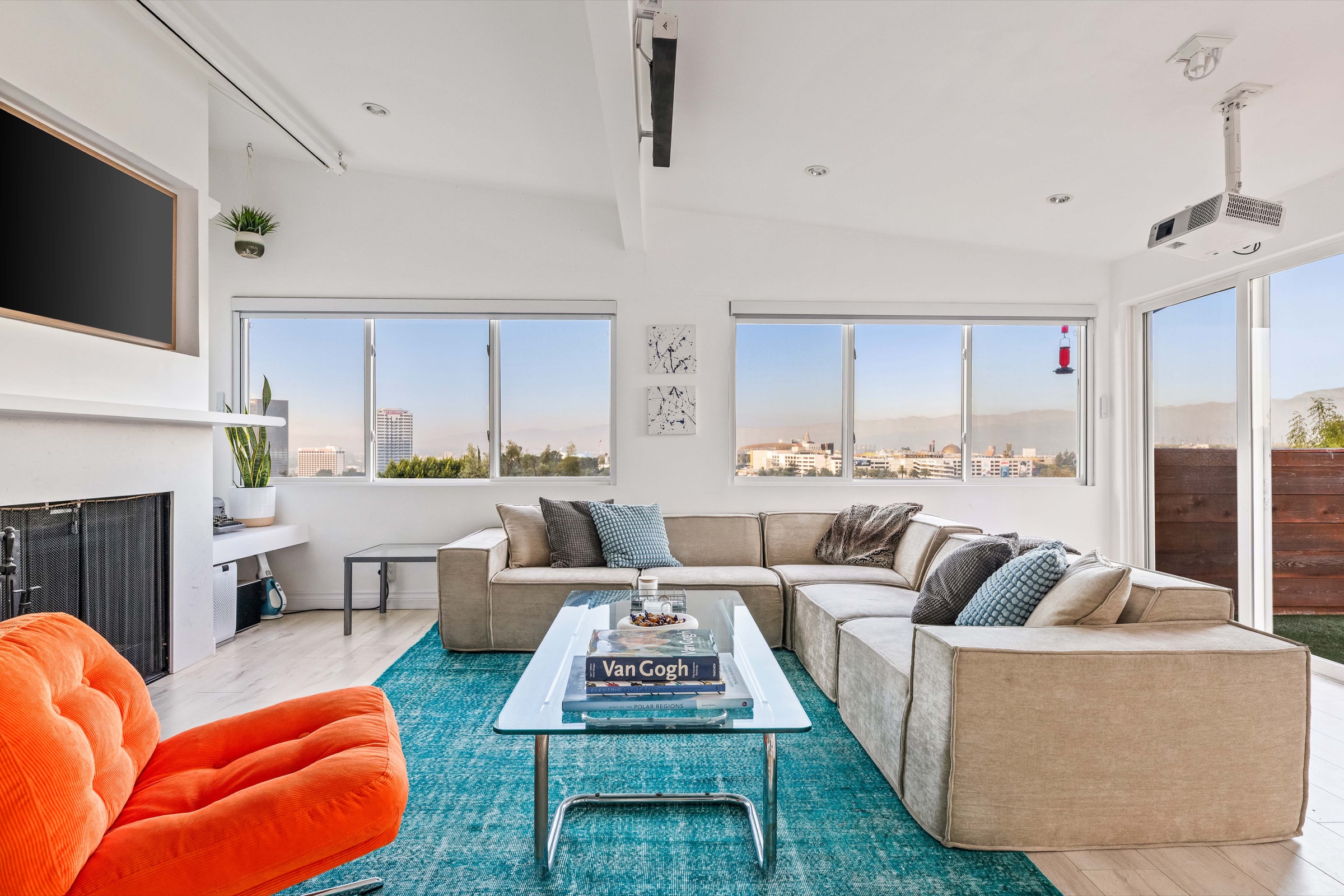 Sunlit Bonnie Hill Inn living room with sweeping Los Angeles views